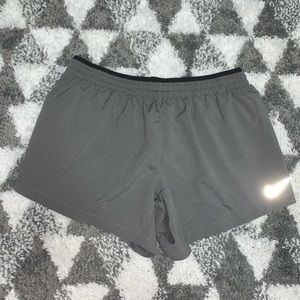 gray nike running shorts size medium